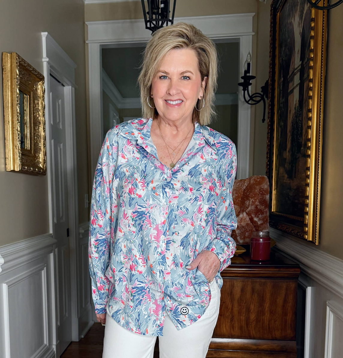 Tania Stephens is wearing a blue print button up shirt from Amazon